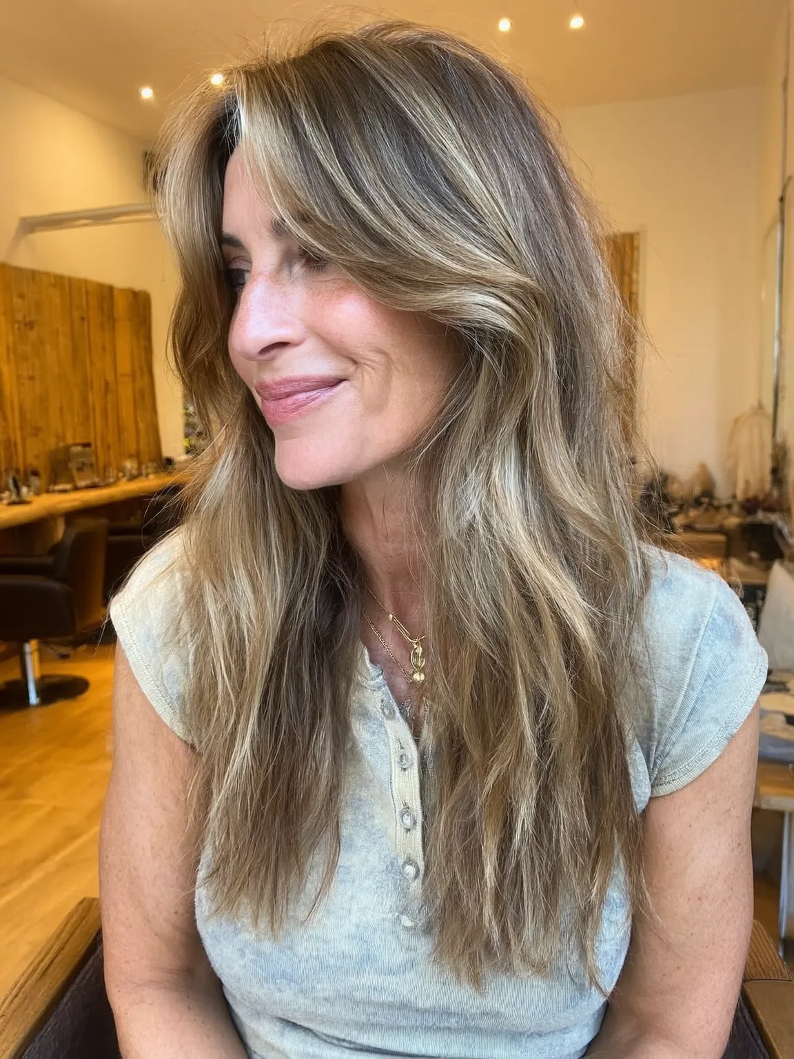 Long Wavy Sandy Blonde Layers with Bronde Lowlights and Curtain Bangs